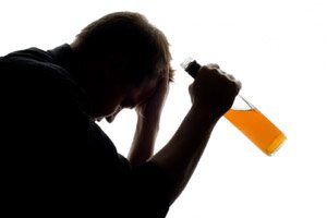 man holding alcohol bottle
