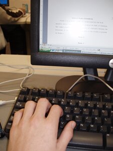 hand on computer