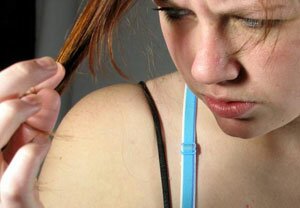 upset teen pulling hair