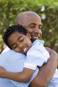 father and son hugging